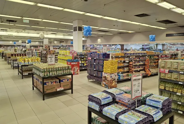 Supermarket aisles stocked with packaged consumer goods